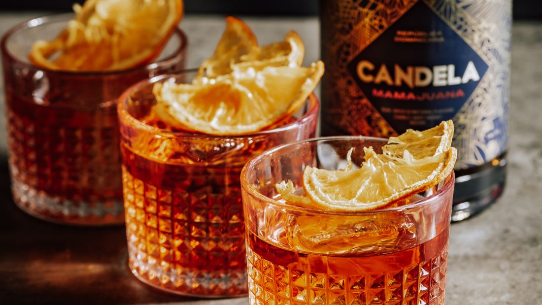 Rum negroni recipe by Candela Mamajuana, "The Negrito". Served over ice with dried orange slices for garnish.